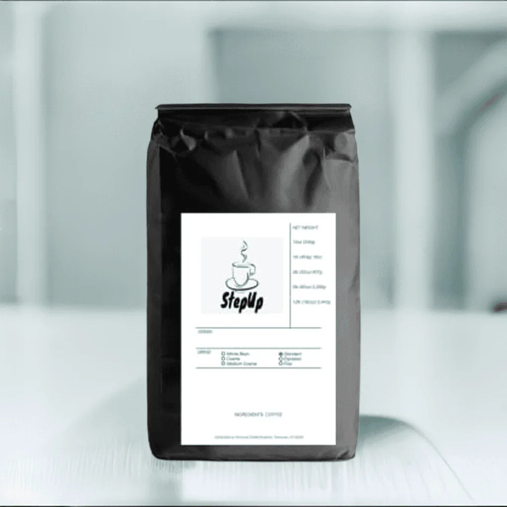 StepUp coffee bag with whole bean label, sleek black packaging, and minimalist design